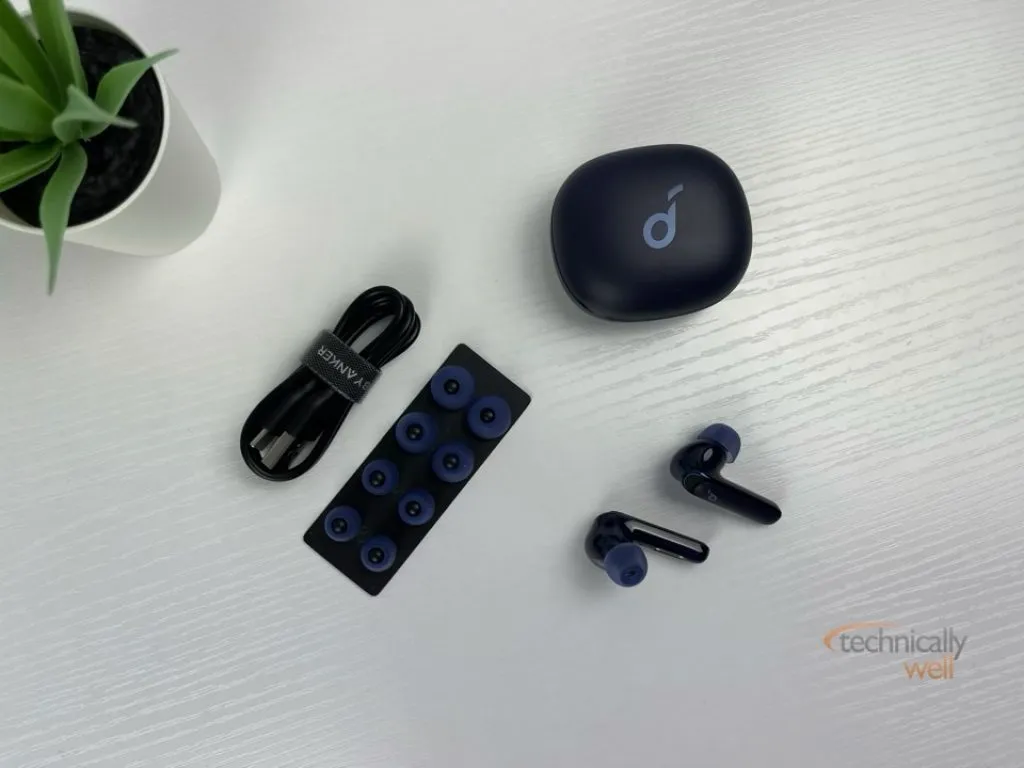 Soundcore Life P3 earbuds and charging case with included accessories: USB-C charging cable and ear tips