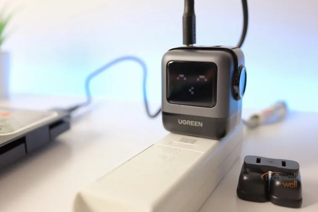 Ugreen Nexode RG 65w Charger with face lit up