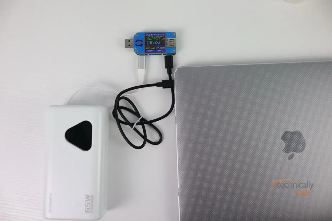 RORRY 25000mAh 65W Laptop Power Bank charging a MacBook Air